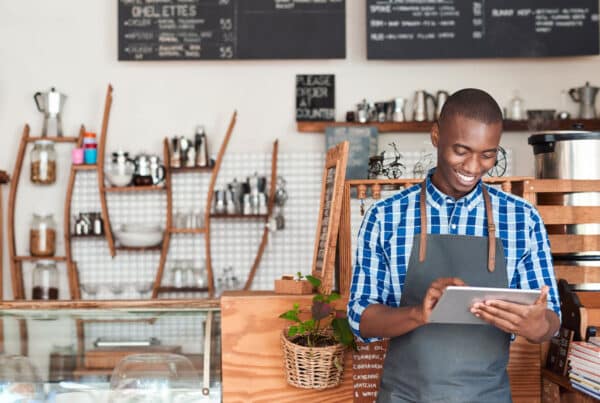 A small business owner inside his coffee